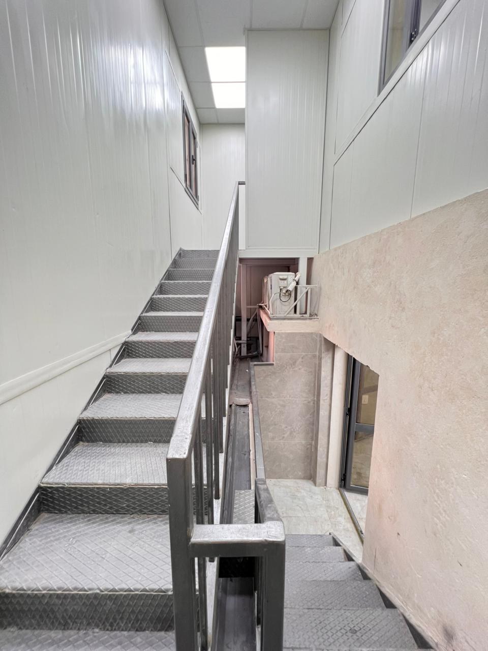 Steel service staircase — upper plant floor